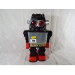 A vintage robot with rotating light picture panel 30cm (h)