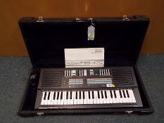 A Yamaha Porta Sound PSS-470 keyboard,