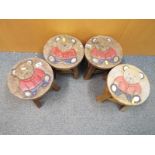 Four children's stools depicting teddy bears 26cm (h) x 25cm (diam)