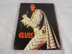 An Elvis Monthly Special annual dated 1975,