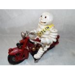 A cast iron model depicting the Michelin man on a motor bike 17cm (h) Est £20 - £30
