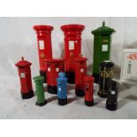 Approximately 11 miniature pillar boxes to include some cast models by Bypost,