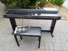 A Yamaha Clavinova CLP550 piano with stool and manual