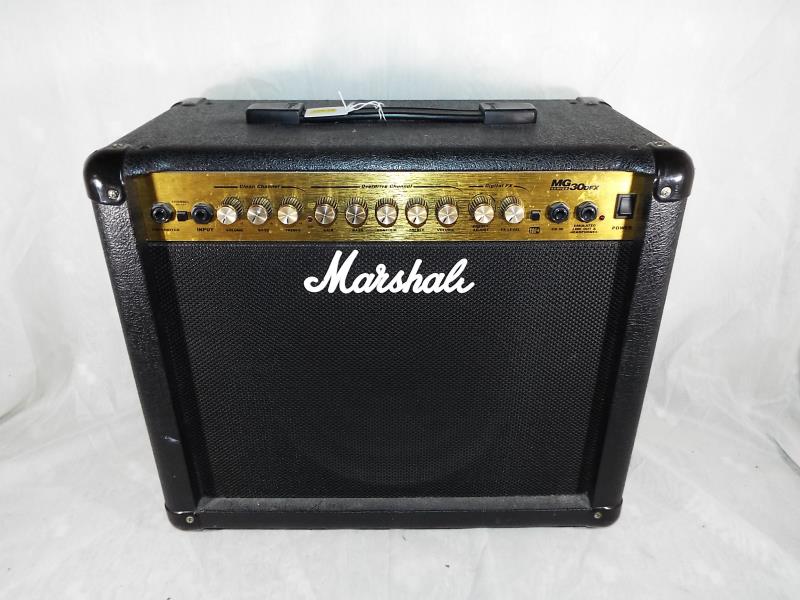 A Marshall MG30DFX 30 watt electric guitar amplifier,