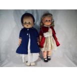 A Pellan dressed doll with jointed arms and legs,