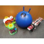 A mixed lot to include a collection of modern toys a Space Hopper, activity centre,