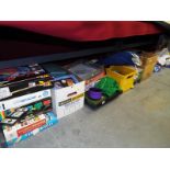 A very large mixed lot of toys to include good quality dressed dolls, bagatelle, board games,