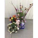 Flower arrangements in bowls and jugs