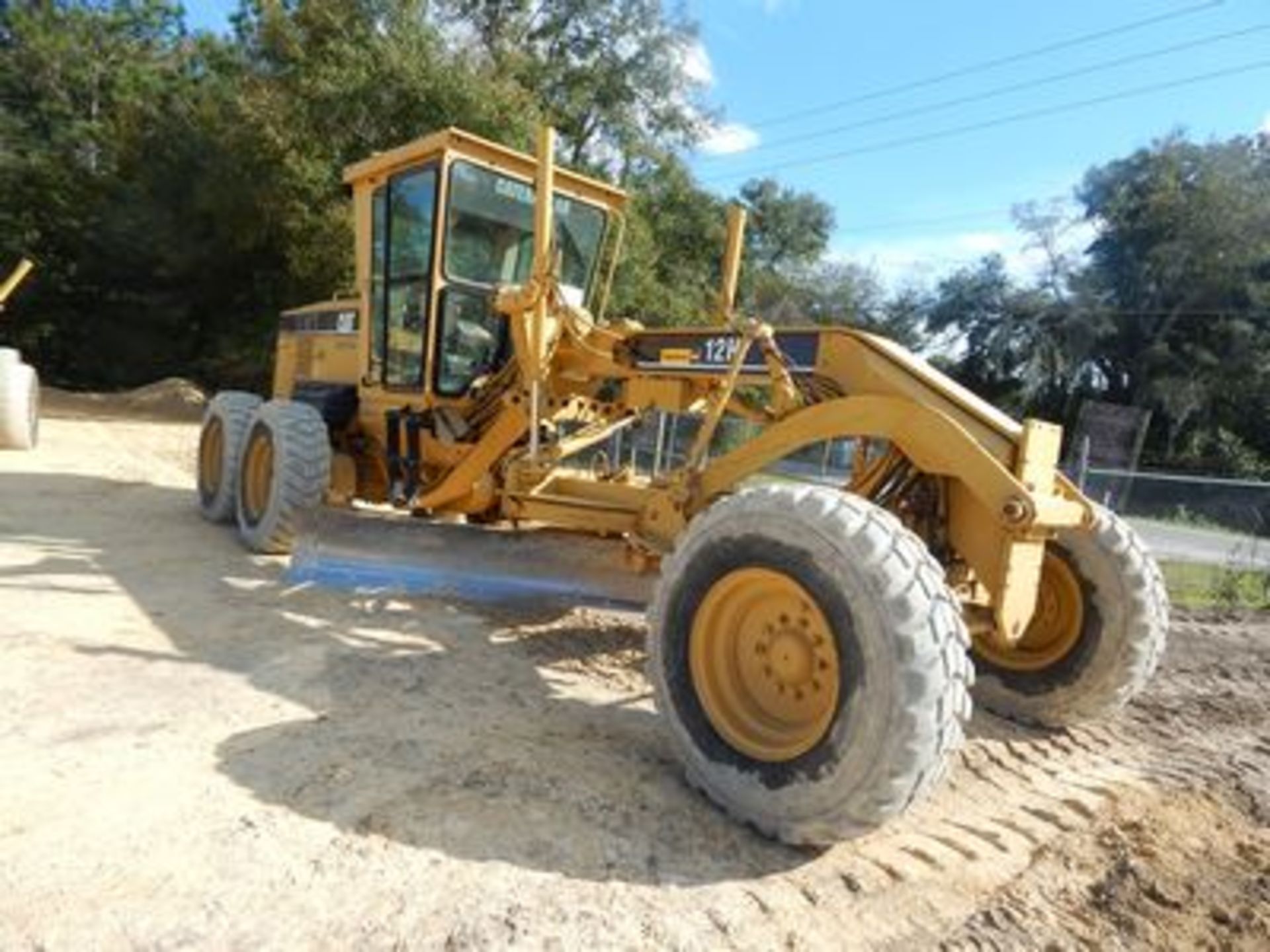 2006 CAT 12H MOTOR GRADER, DIESEL, 14' MOLDBOARD, 5' FRONT CARIFIER, ENC. CAB., HEAT/AIR, 2,135