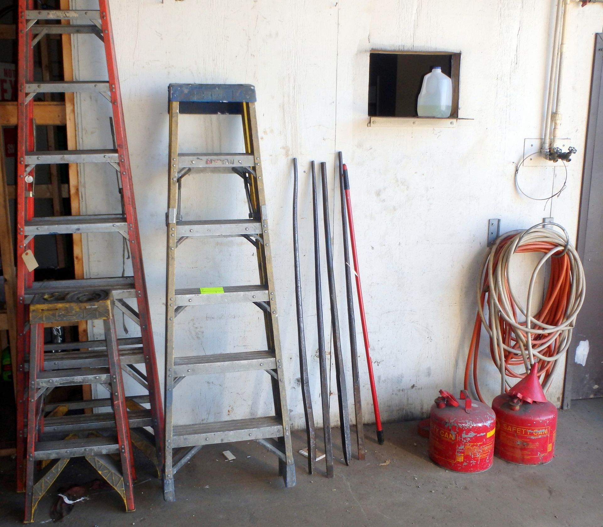 Lot of Assorted Ladders, Spud Bars, Gas Cans, Hoses