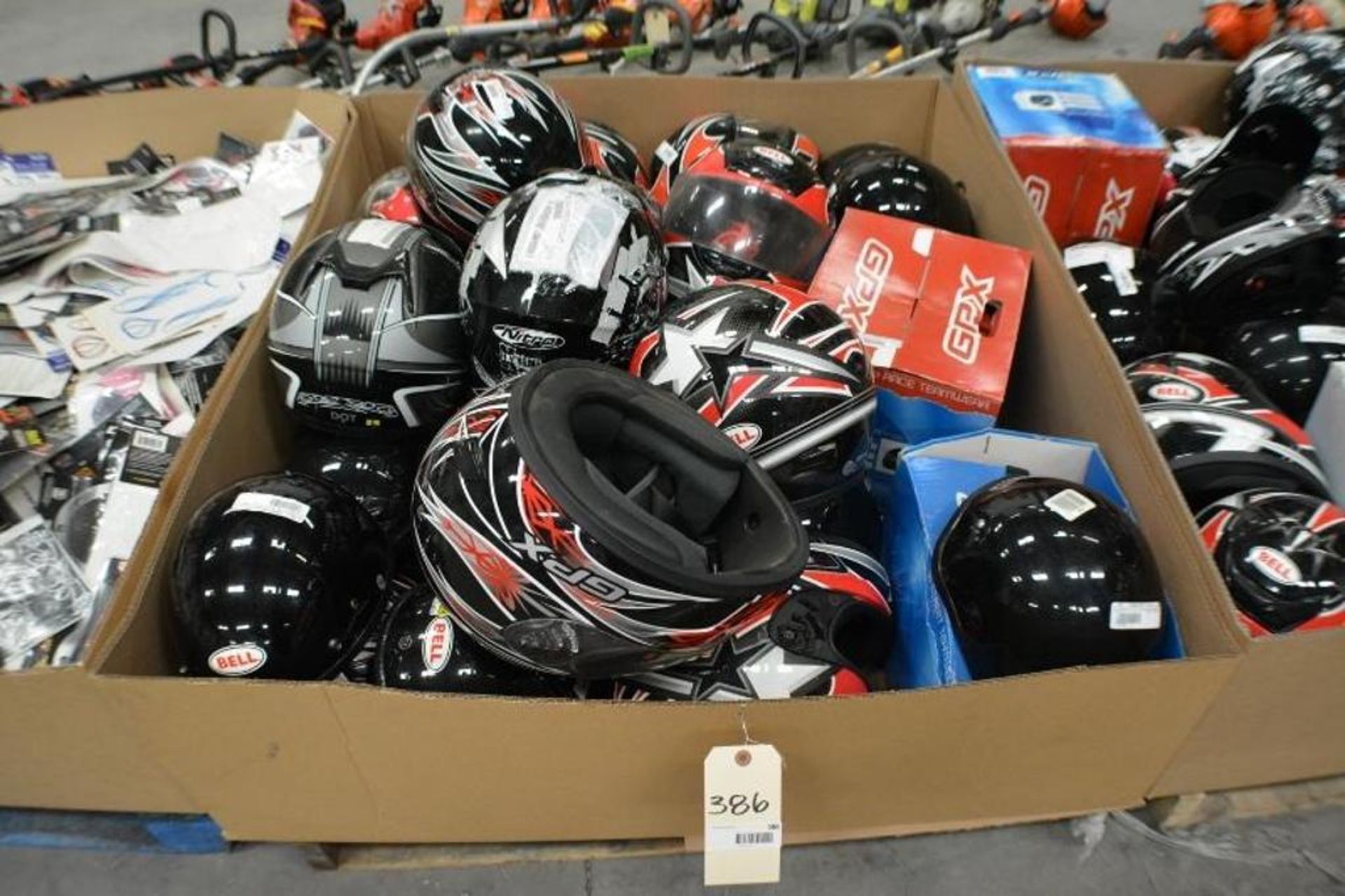 Motorcycle Helmets. Assorted Sizes by GPX and Bell. Contents of Gaylord