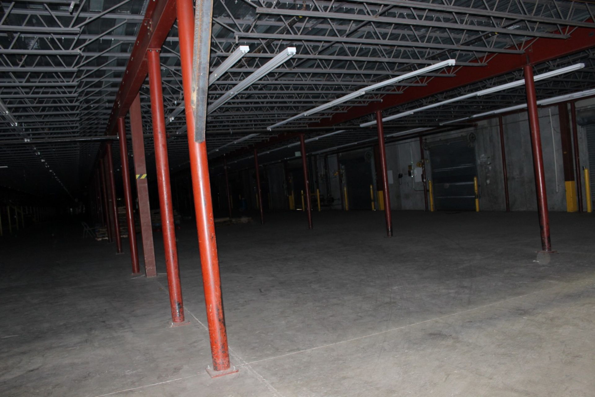 1200 SQ FT OF MEZZANINE WITH SOLID METAL INTERLOCK DECKING, (80' x 15' )  COLUMN SPACING 240" X 180"