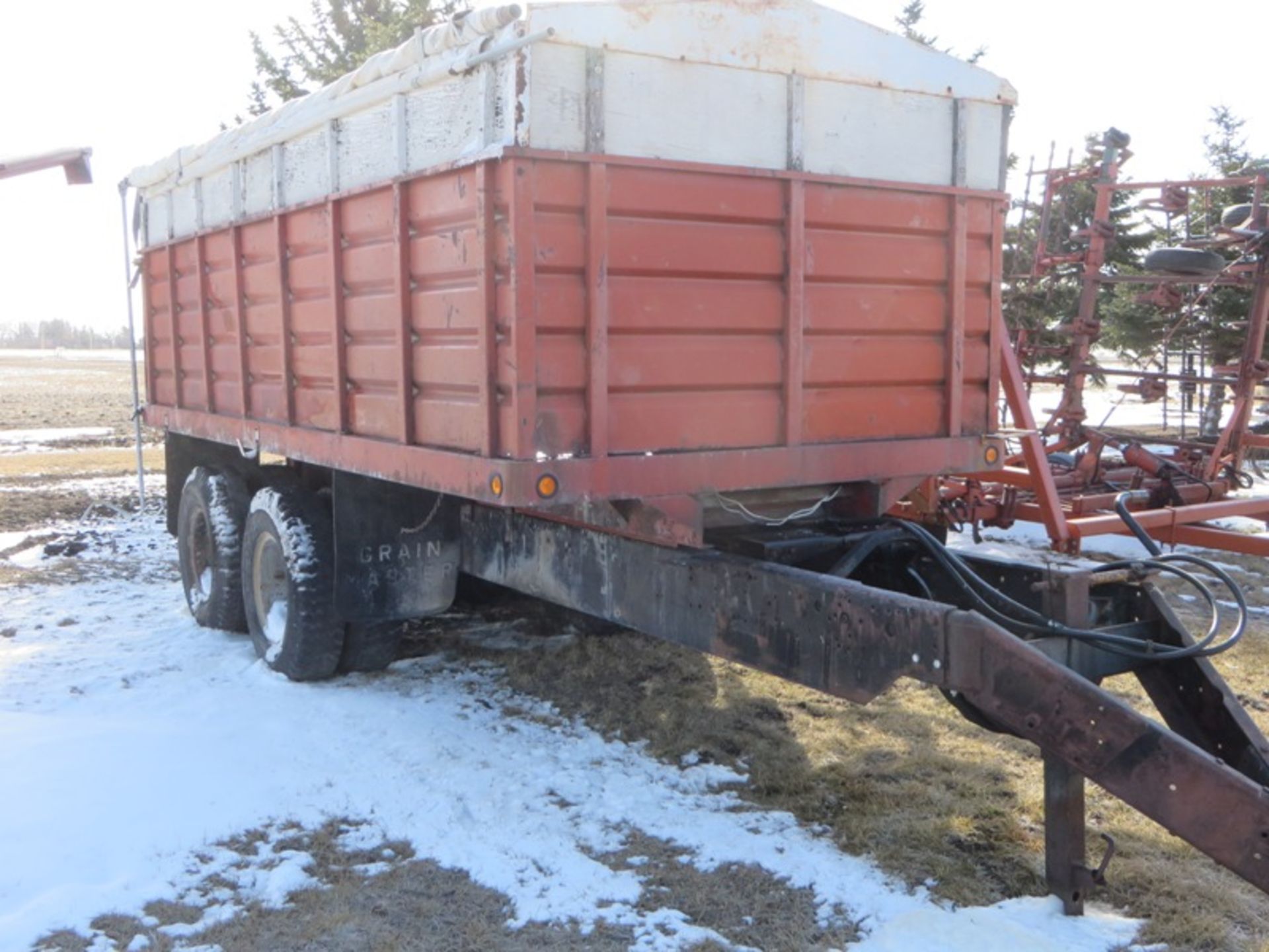 Red grain box tandem trailer