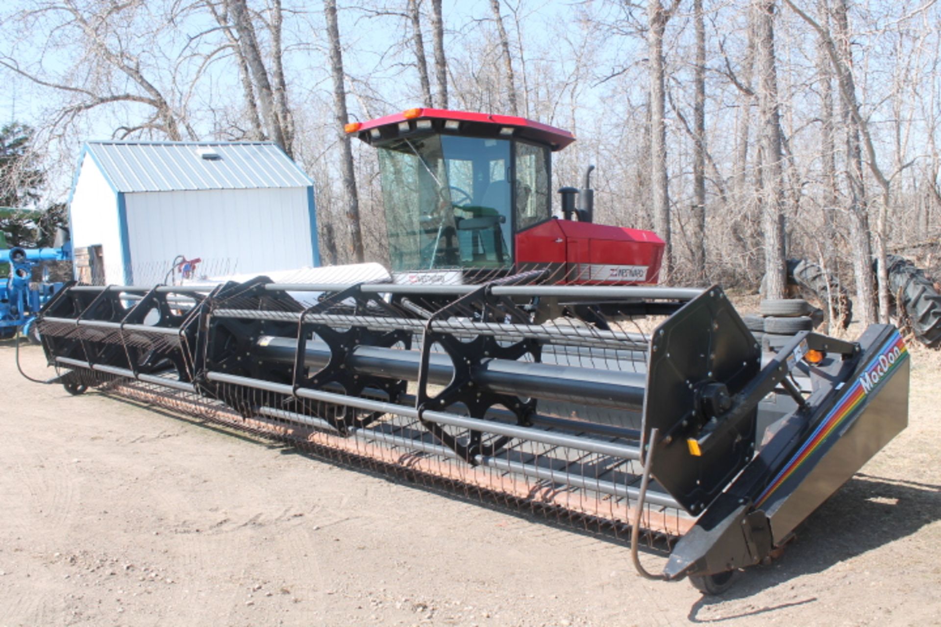 30’, 2 spd trans,  2300hrs, c/w 30’ MacDon 972 harvest header, PU reels, 2 seasons on canvas *25%