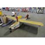 Yellow Seamaster RC Plane body.  No motor present and limited electronics.  7.5ft wingspan.  6.5ft