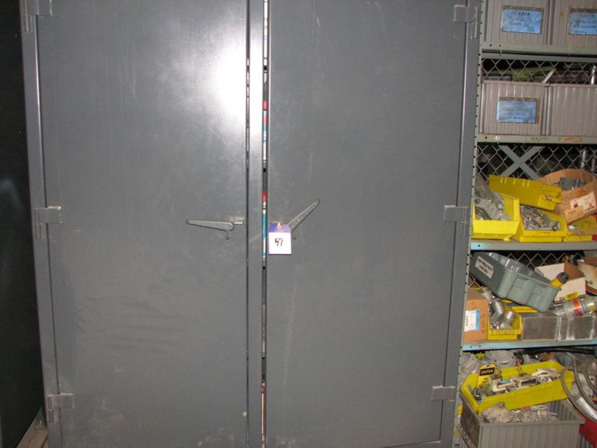 Lot includes Stronghold heavy duty storage cabinet with misc. supplies