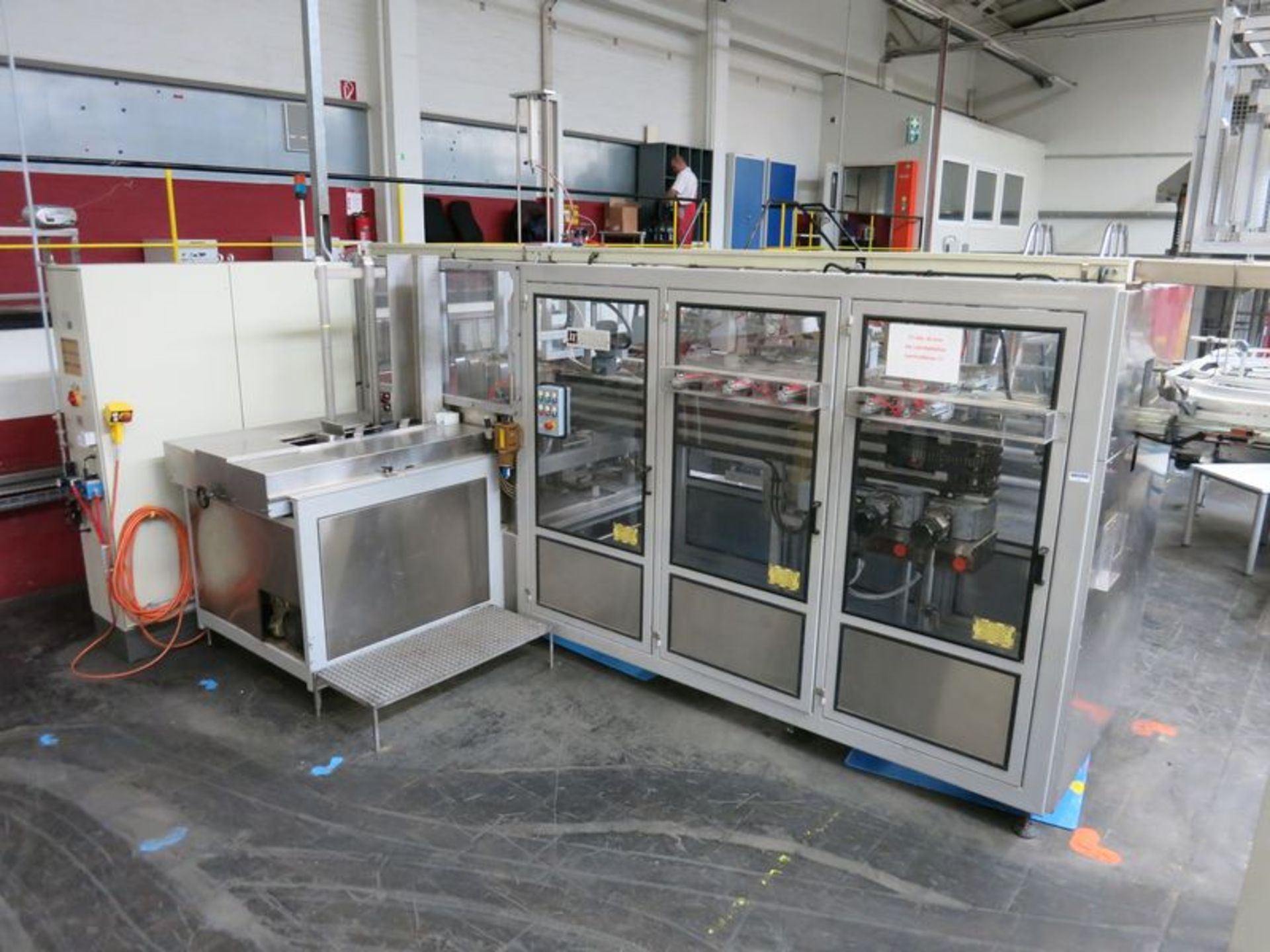 Involvo  case packer, model PTW-28-MW, s/n 20004052, with (4) fold cup stacker and Nordson hot