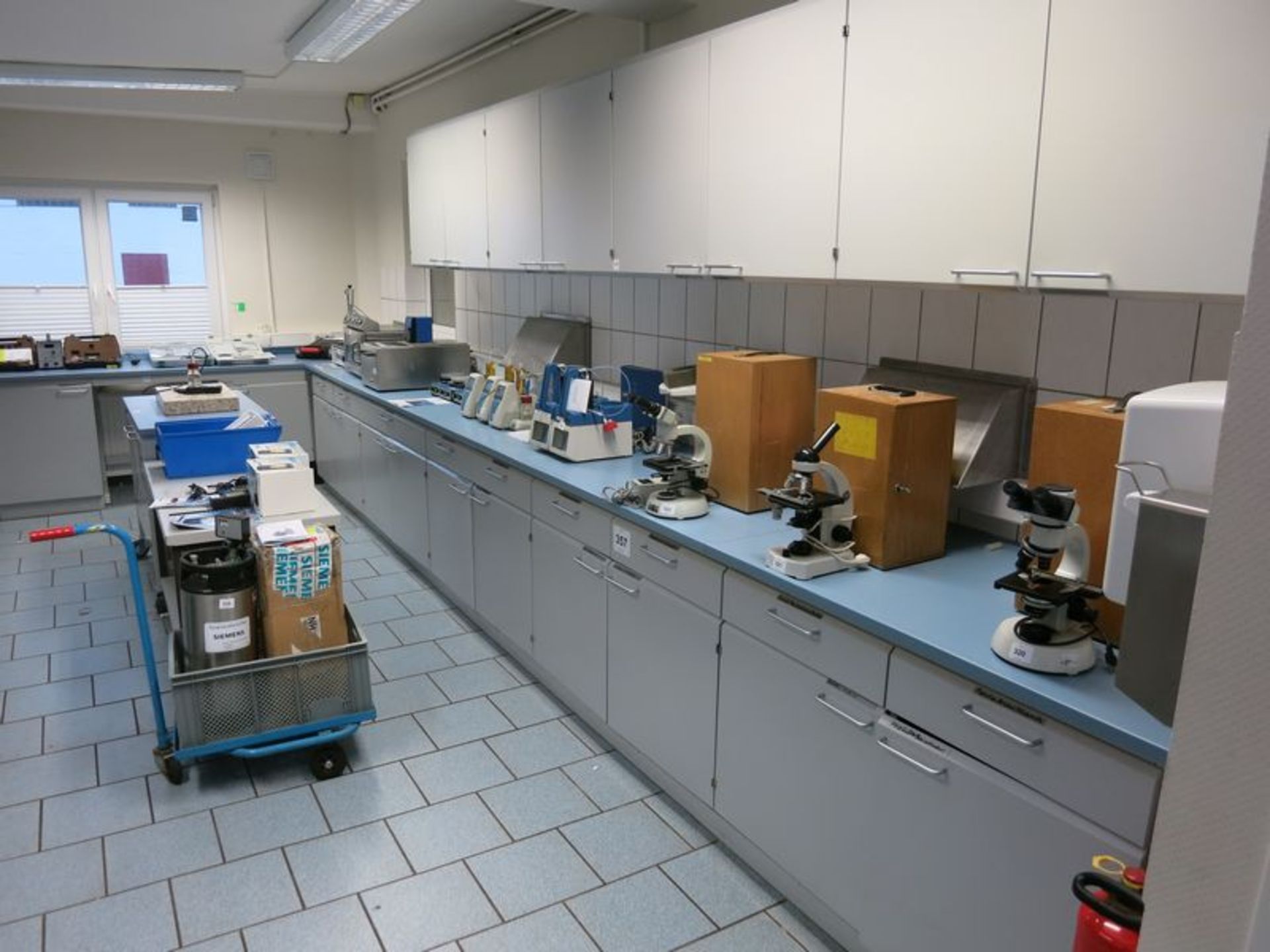 Lot of Laboratory furniture, counters, sinks, tables, wall cabinets  [Location: Bldg 6.]