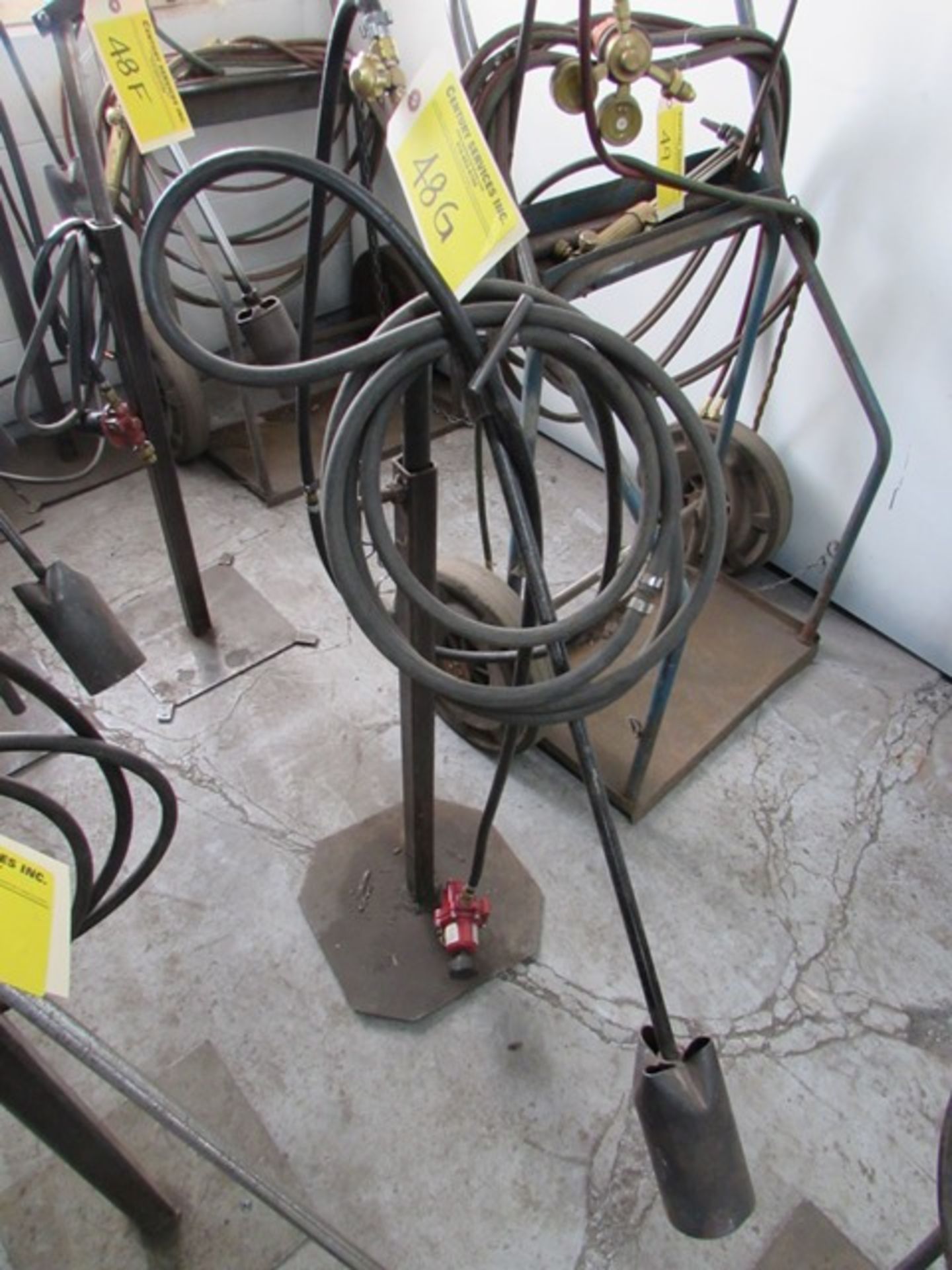 Welding torch on adjustable height stand