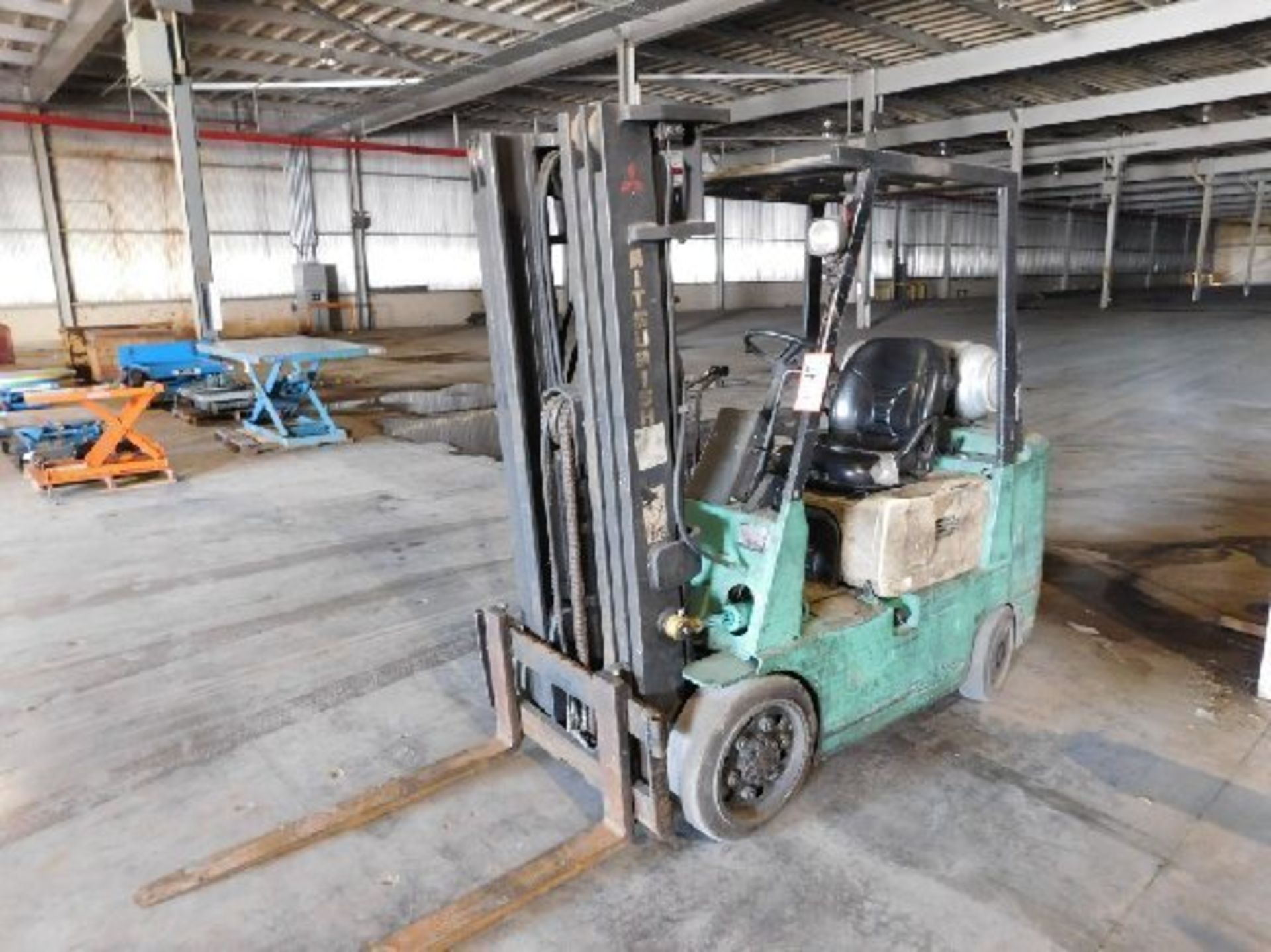 Mitsubishi FGC25 Forklift, 5,000lb. 139" Lift Height, LP Gas, 3 Stage Mast, solid tires - THIS