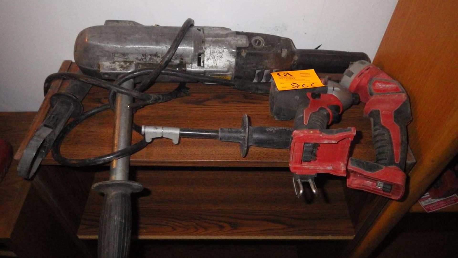 One electric drill, one cordless Milwaukee drill, and One cordless flash light