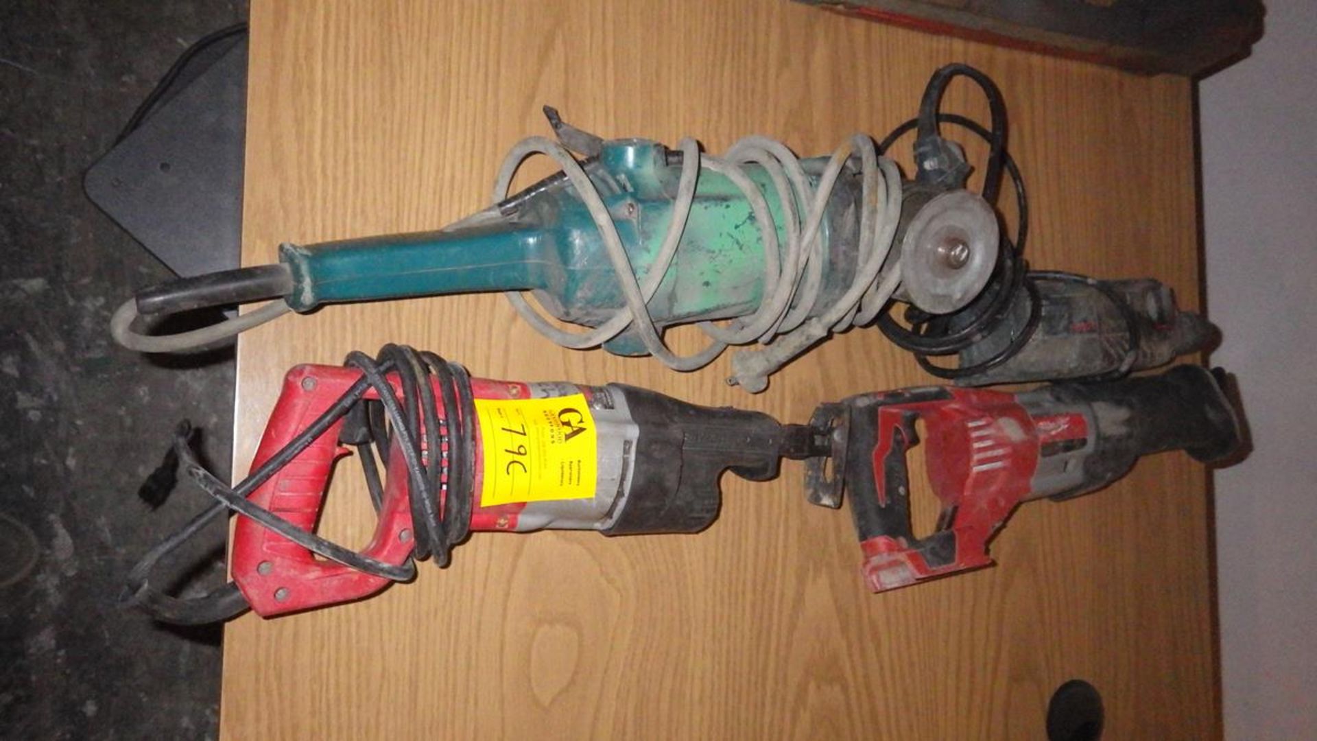 Two Milwaukee reciprocating saws one bosch hammer drill and one angle grinder
