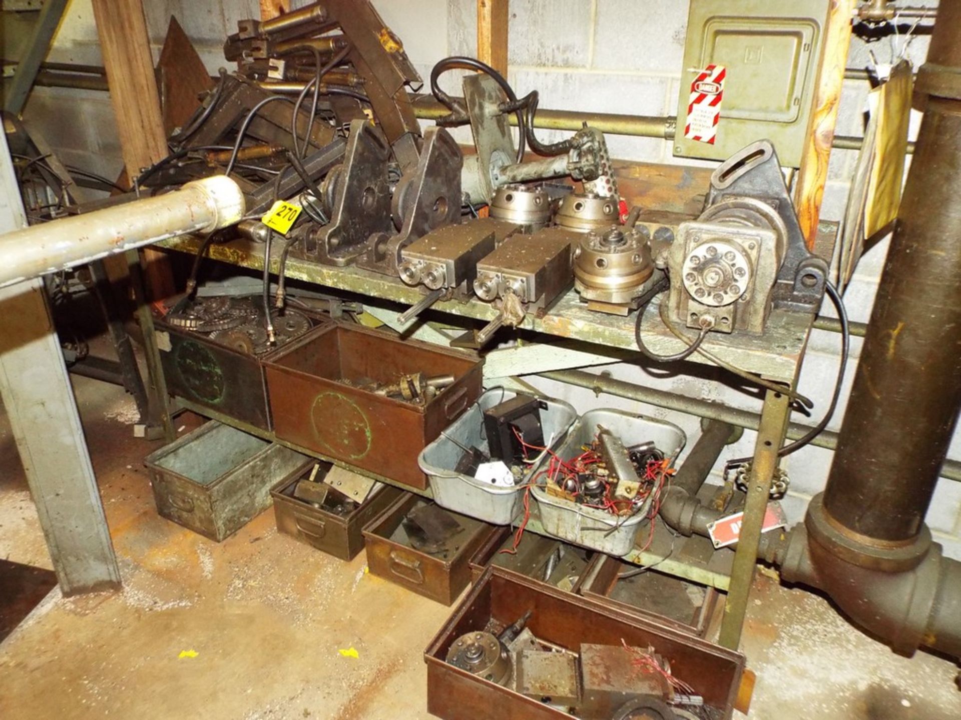 ASSORTED MACHINE PARTS ON WOOD TOP