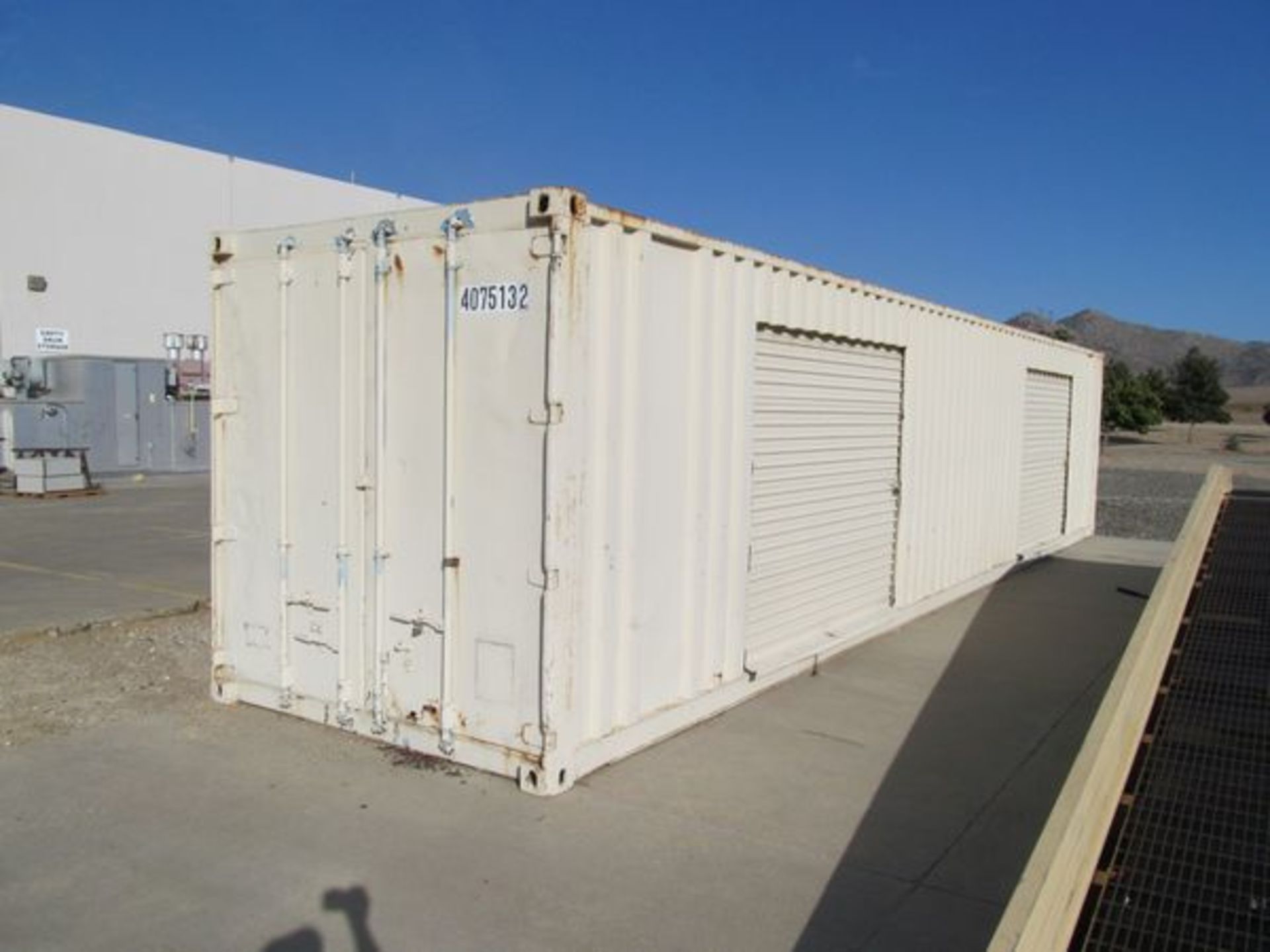 40' Shipping Container , w/ ContentsTwo Built-In Roll Up Doors Installed On Side. (Loc. Outside