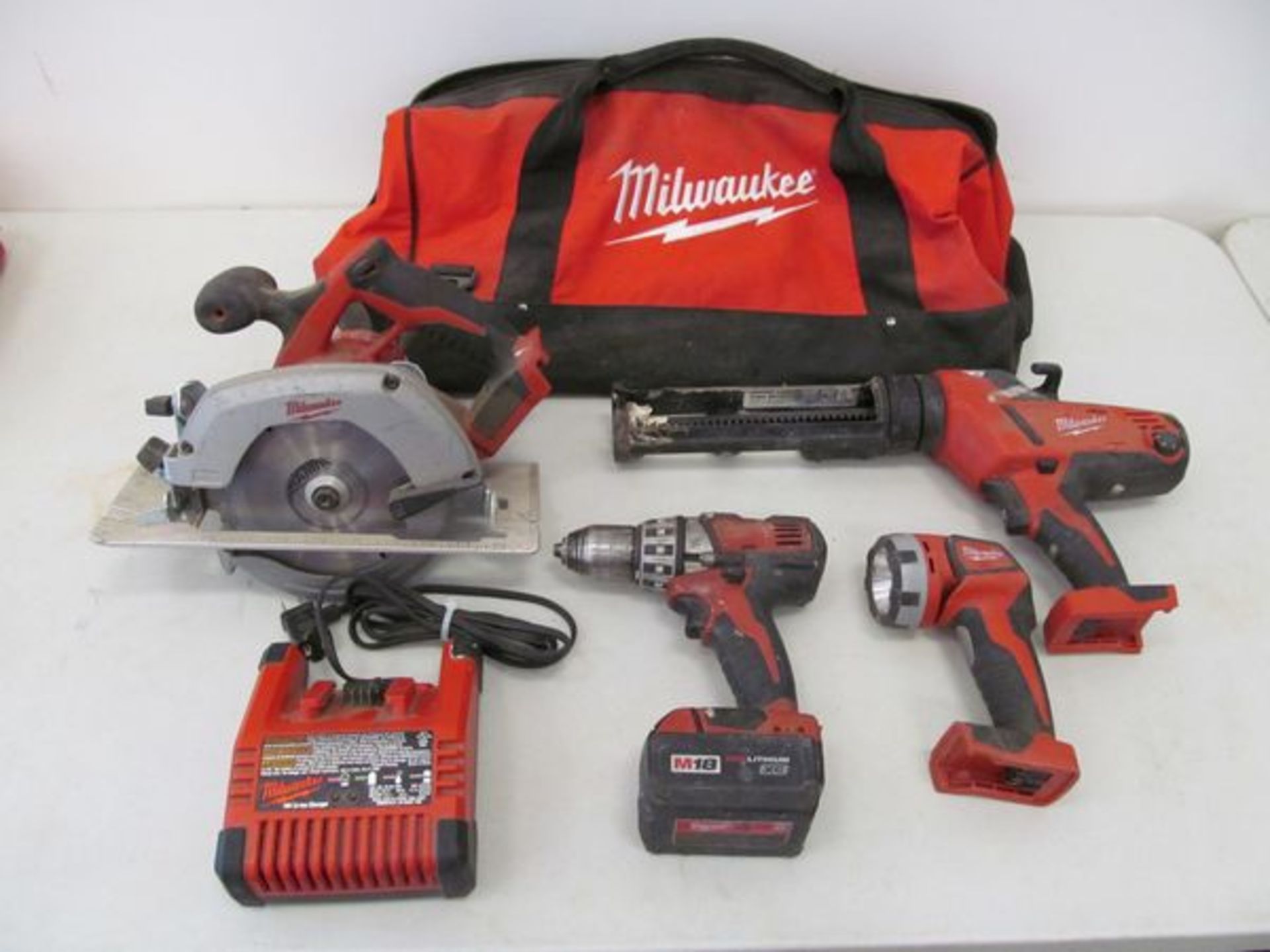 Milwaukee Cordless Powered Hand Tools , to Include: (1) Circular Saw(1) Drill(1) Caulk Gun(1)