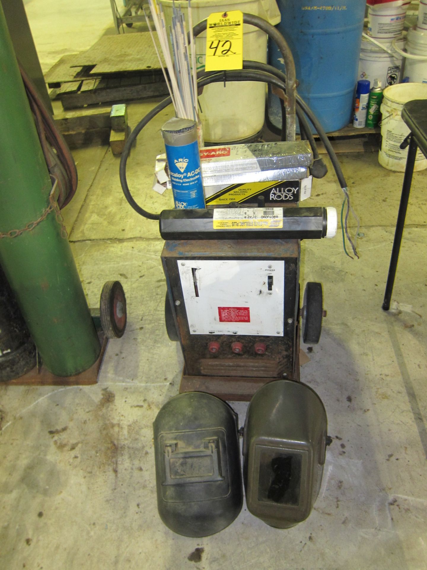 WELDER WITH WELDING ROD AND HELMITS MILLER