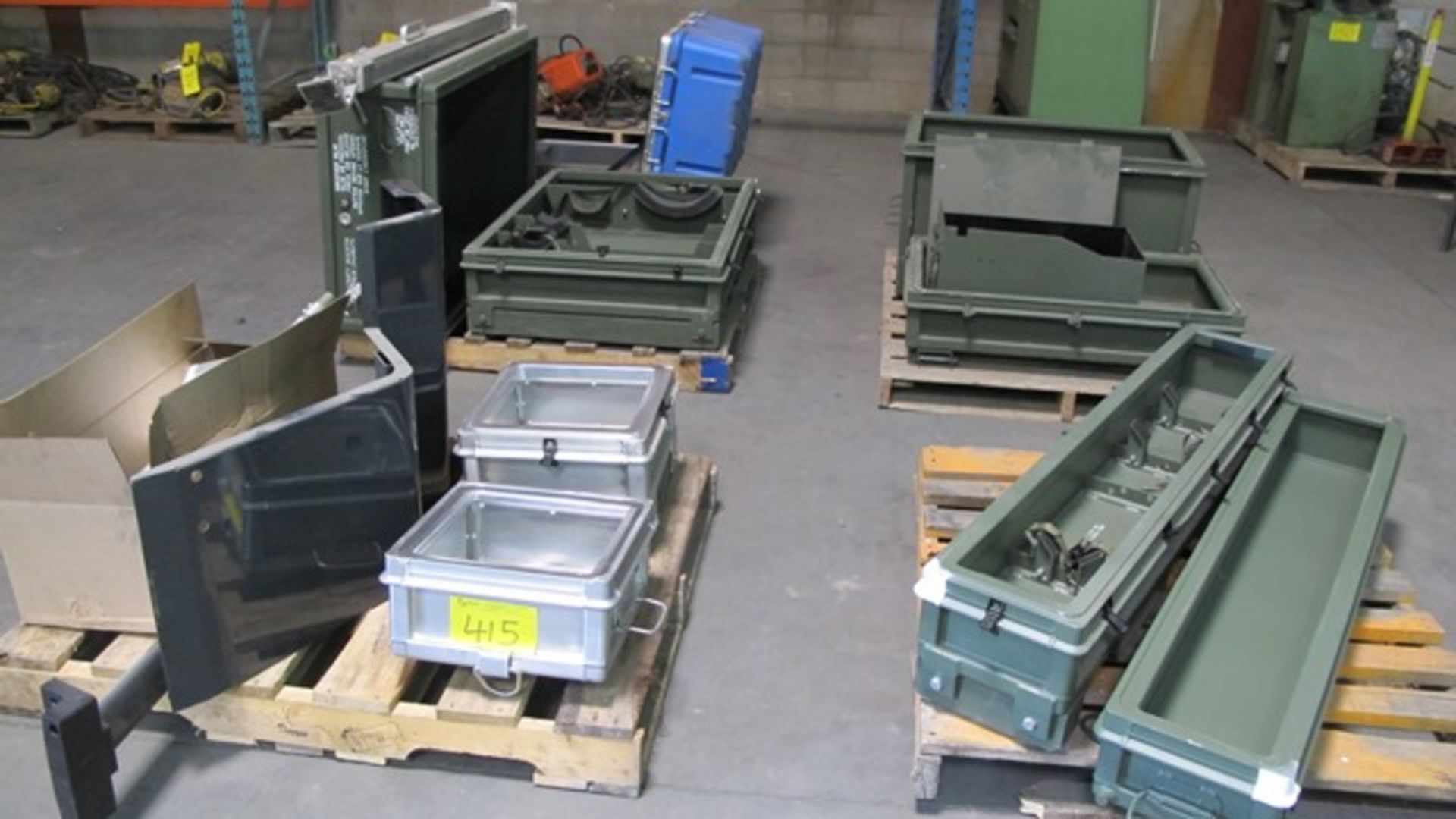 PALLETS OF MILITARY PRODUCT STORAGE CONTAINERS