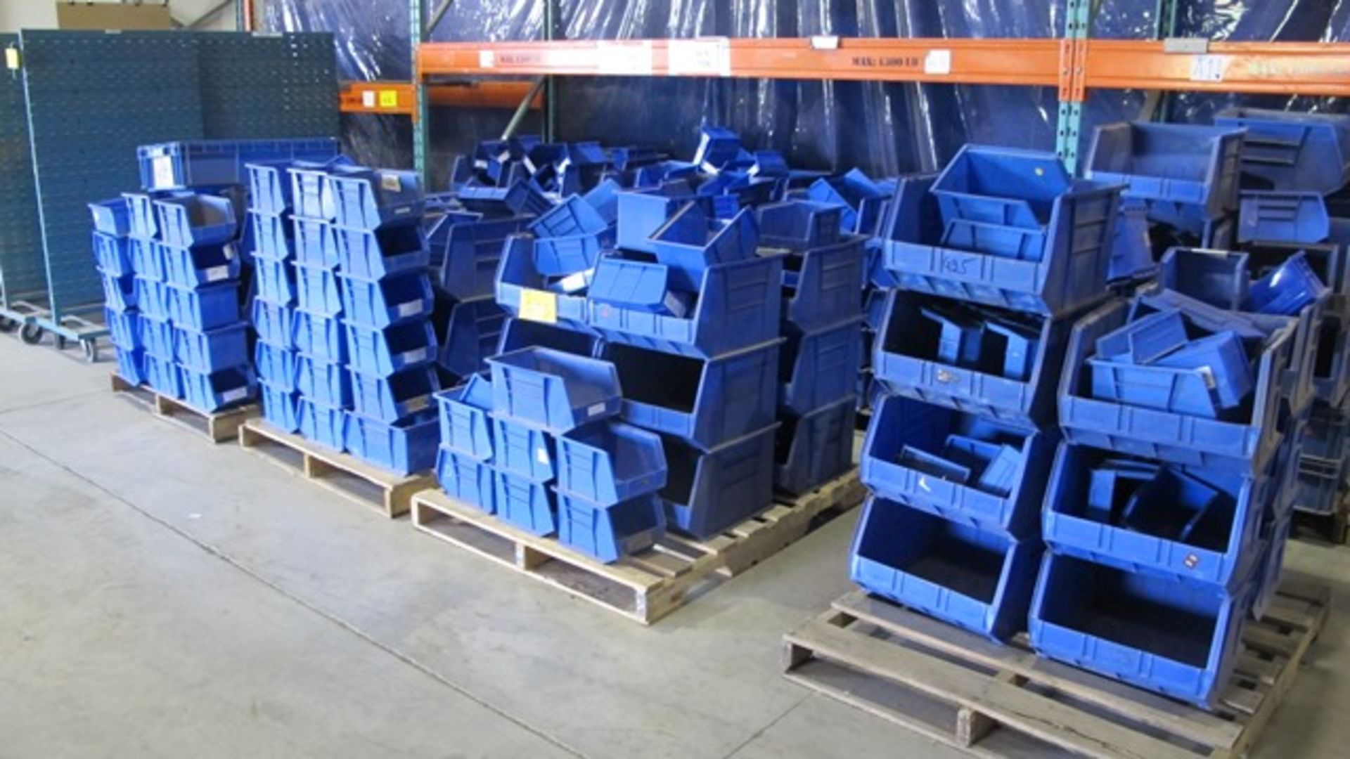 PALLETS OF BLUE PLASTIC STORAGE BINS