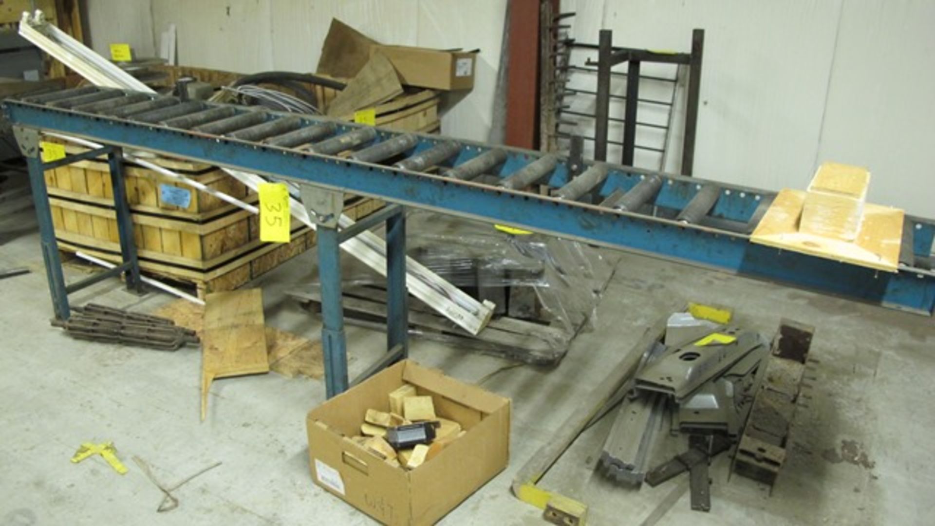 LOT OF ROLLER CONVEYOR, 2 CRATES OF LUBRICANTS, PALLET OF STEEL PARTS