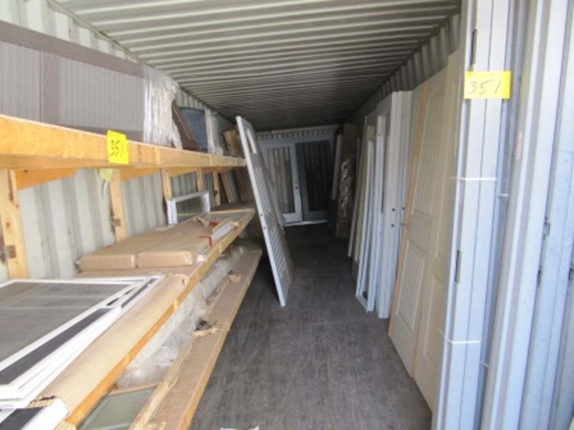 LOT CONTENTS OF CONTAINER - DOORS, FRAMES, SHUTTERS, ETC.