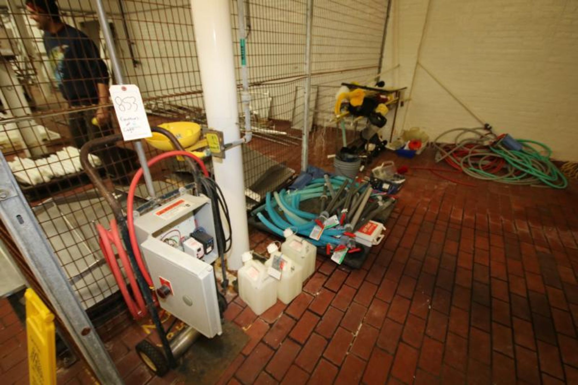 Contents of Cage including Chemical Pumps, Containments, Barrel Pumps, Cleaning Brushes, Hose (NOTE: