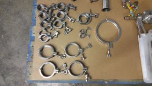 Assorted S/S Clamps from 1" to 7" including (14) 2" (8) 4" (1) 3.5" (2) 1" and (1) 7"