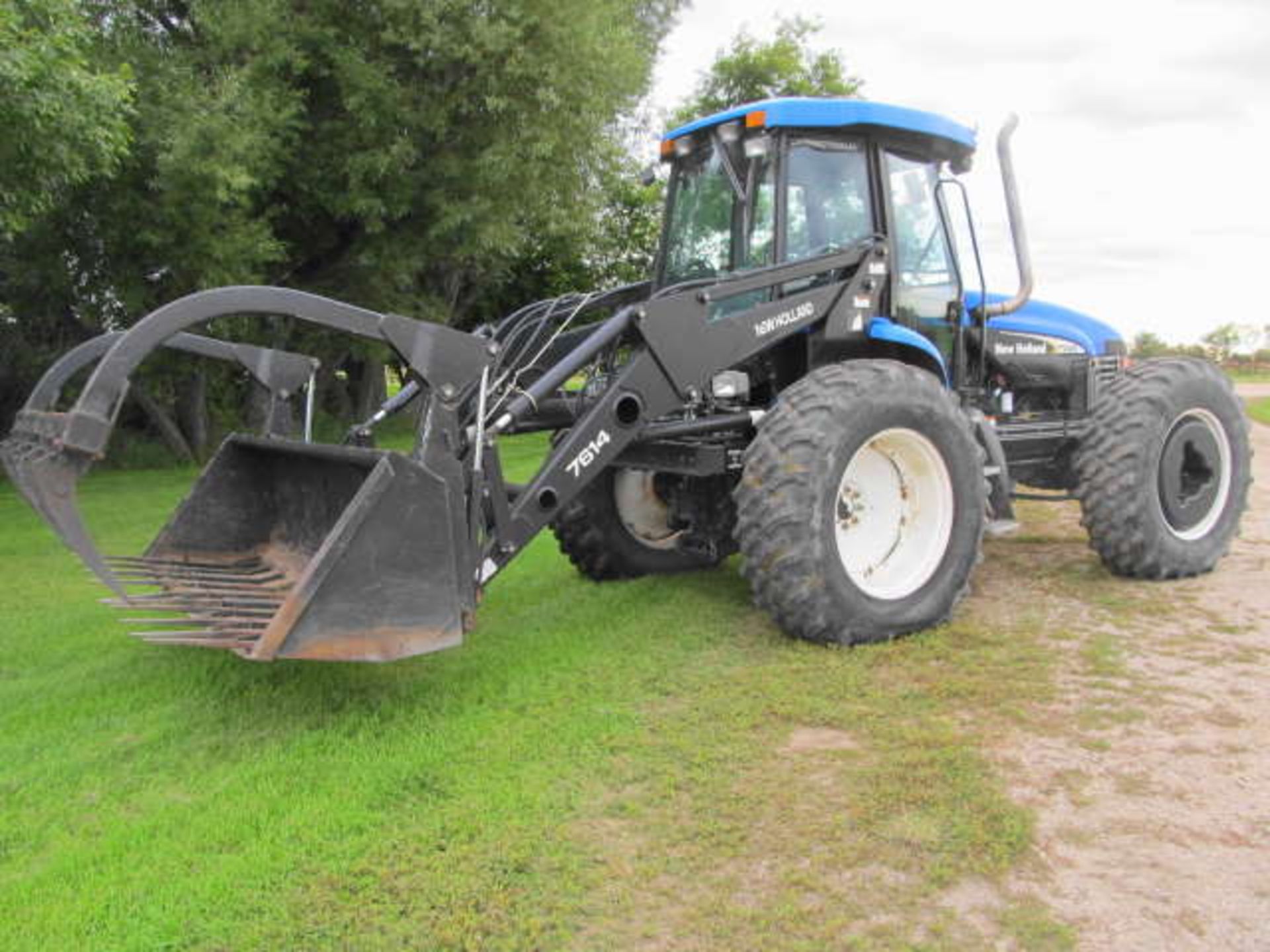 2004 NEW HOLLAND TV 145 BI-DIRECTIONAL TRACTOR; 4065 Hours, New Holland 7614 FEL & Grapple, PTO Both