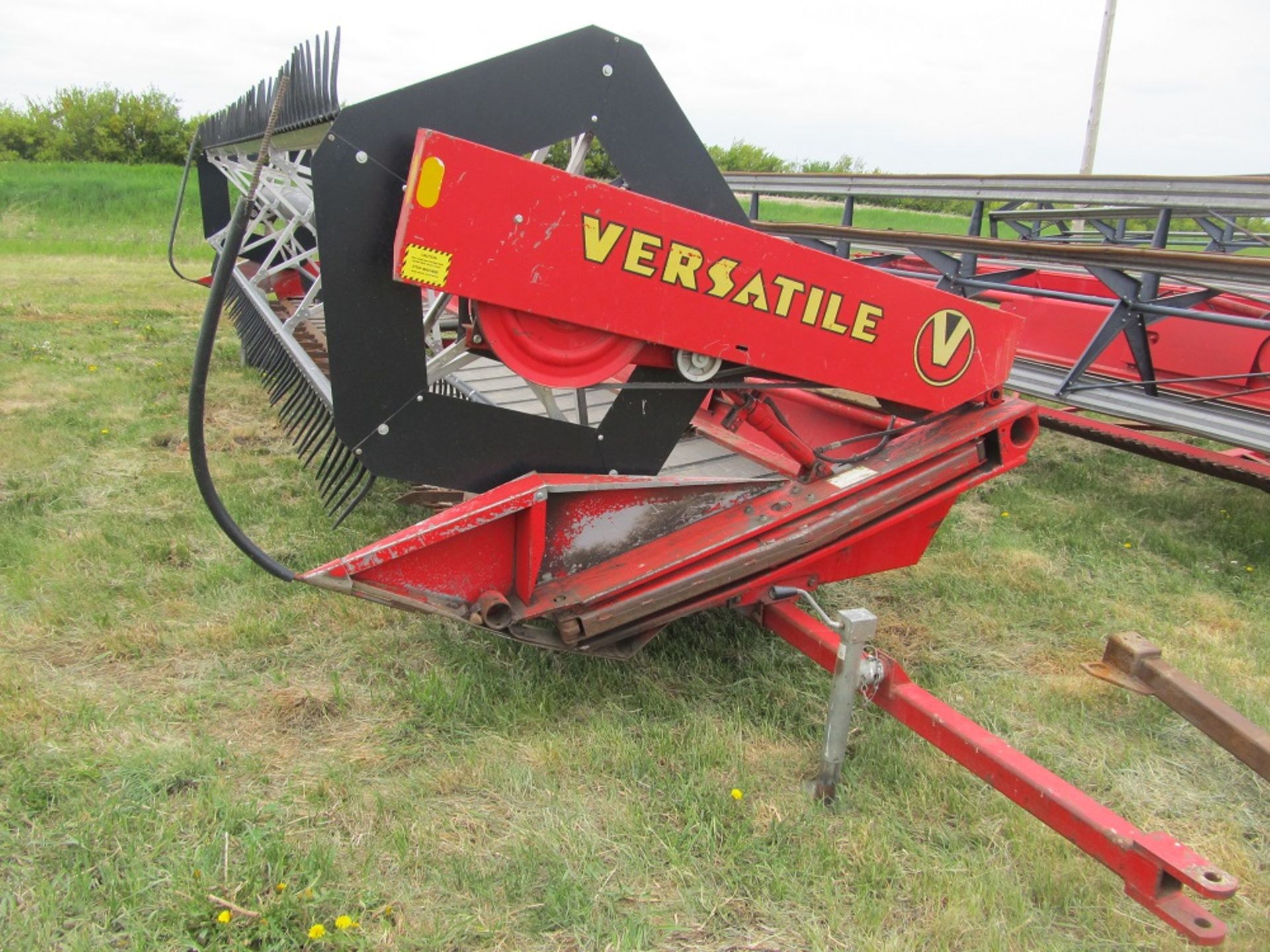 VERSATILE 2400 BI-DIRECTIONAL SWATHER HEADER; Batt Reel (Roland Carles 306-869-2950) C-2