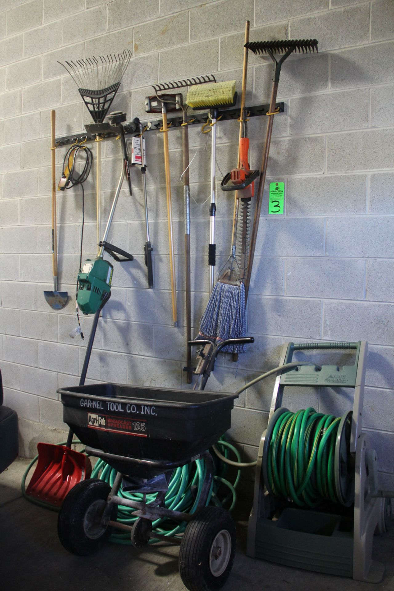 Lot of Yard Tools Including Hose and Reel, Salt Spreader, Trimmer, Edger