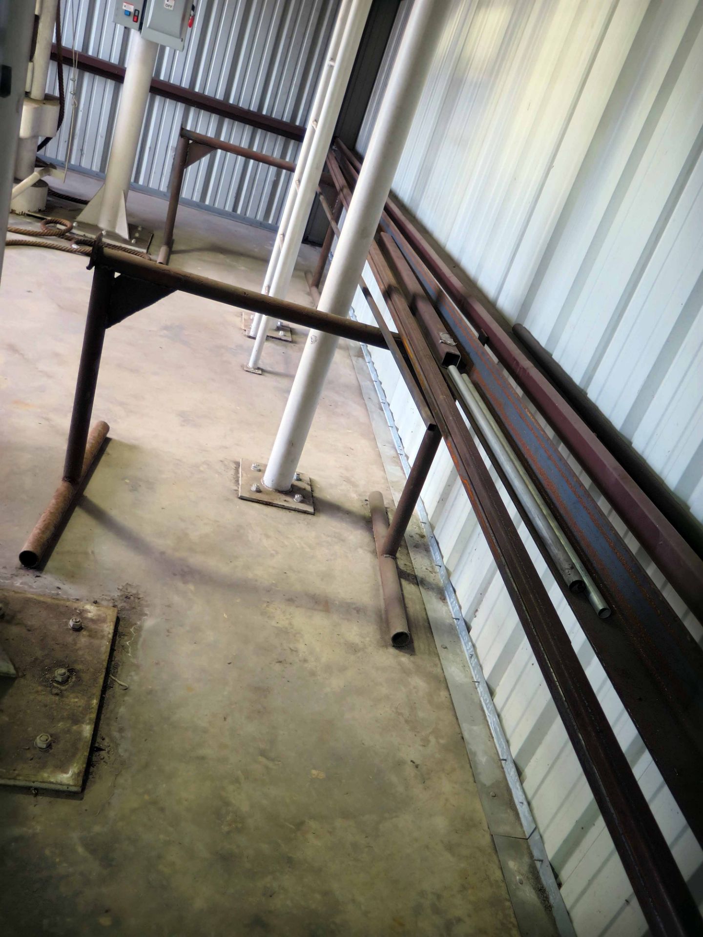 LOT OF METAL TUBING, ANGLE IRON, ETC.  (on two fabricated stands)