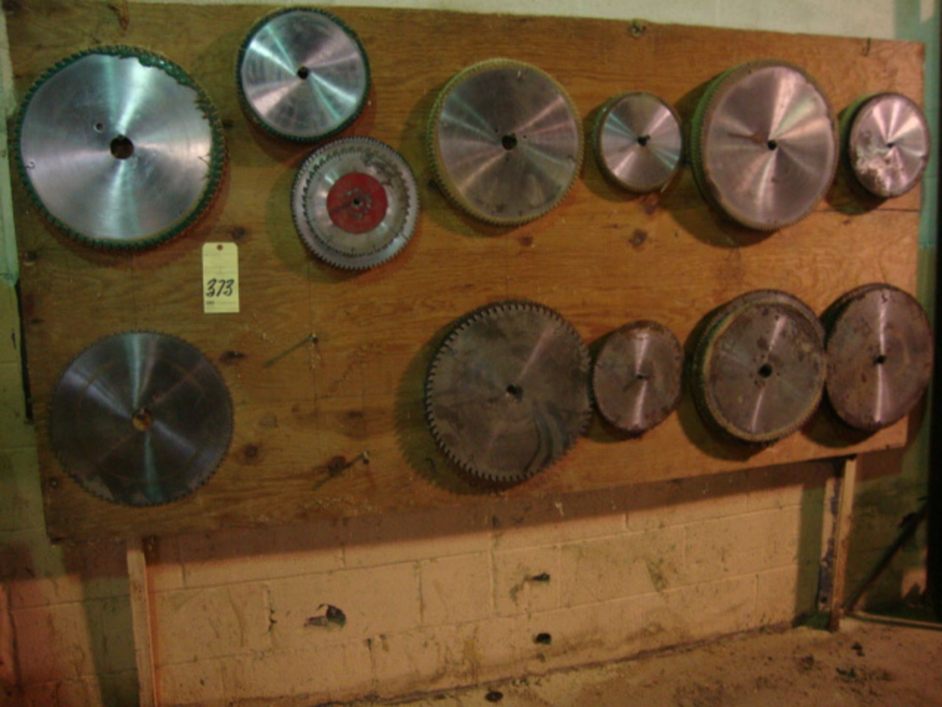 LOT OF SAW BLADES  (located on wall)