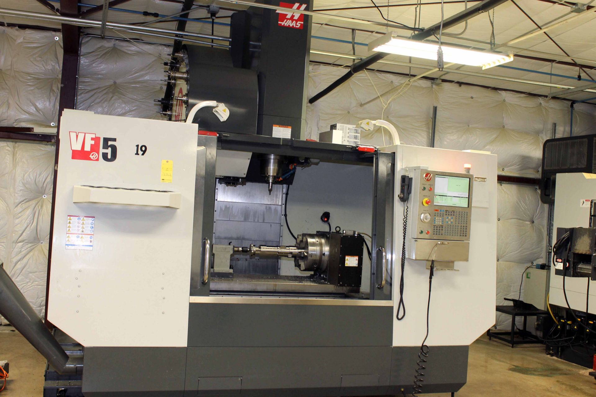 4-AXIS CNC VERTICAL MACHINING CENTER, HAAS MDL. VF5/50, new 12/2012, 52â€ x 23â€ tbl., 4000 lb.