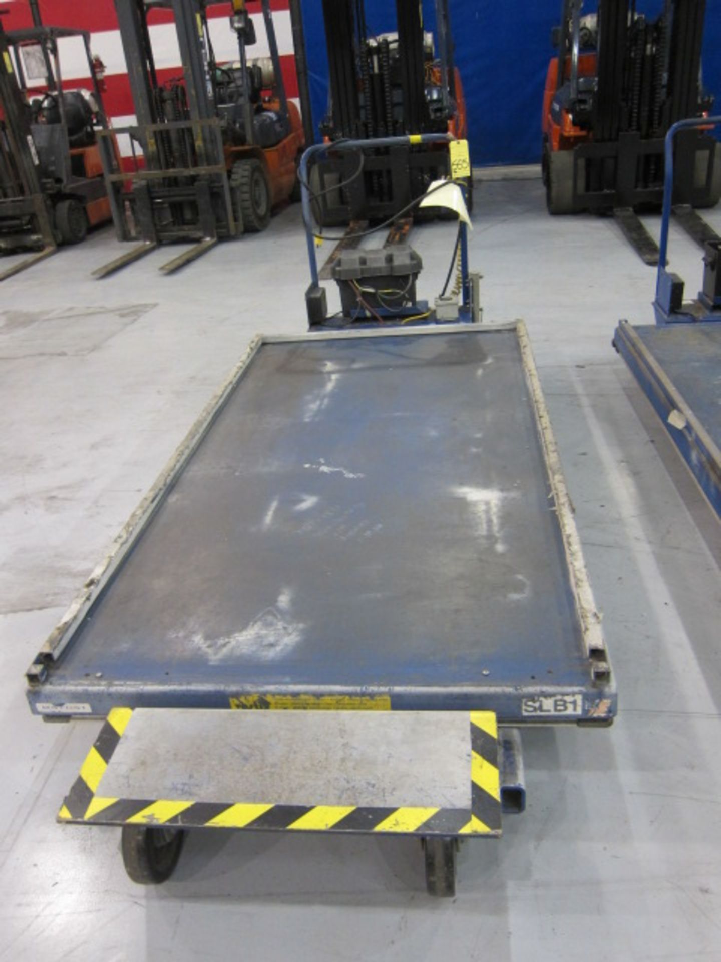 POWER SCISSOR LIFT TABLE, VESTIL MFG., approx. 1,500 lb. cap., 48" x 90" platform, battery operated,