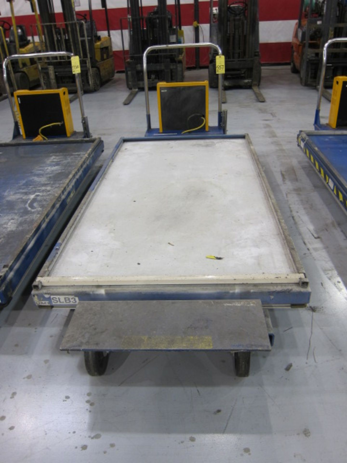 POWER SCISSOR LIFT TABLE, VESTIL MFG., approx. 1,500 lb. cap., 48" x 90" platform, battery operated,
