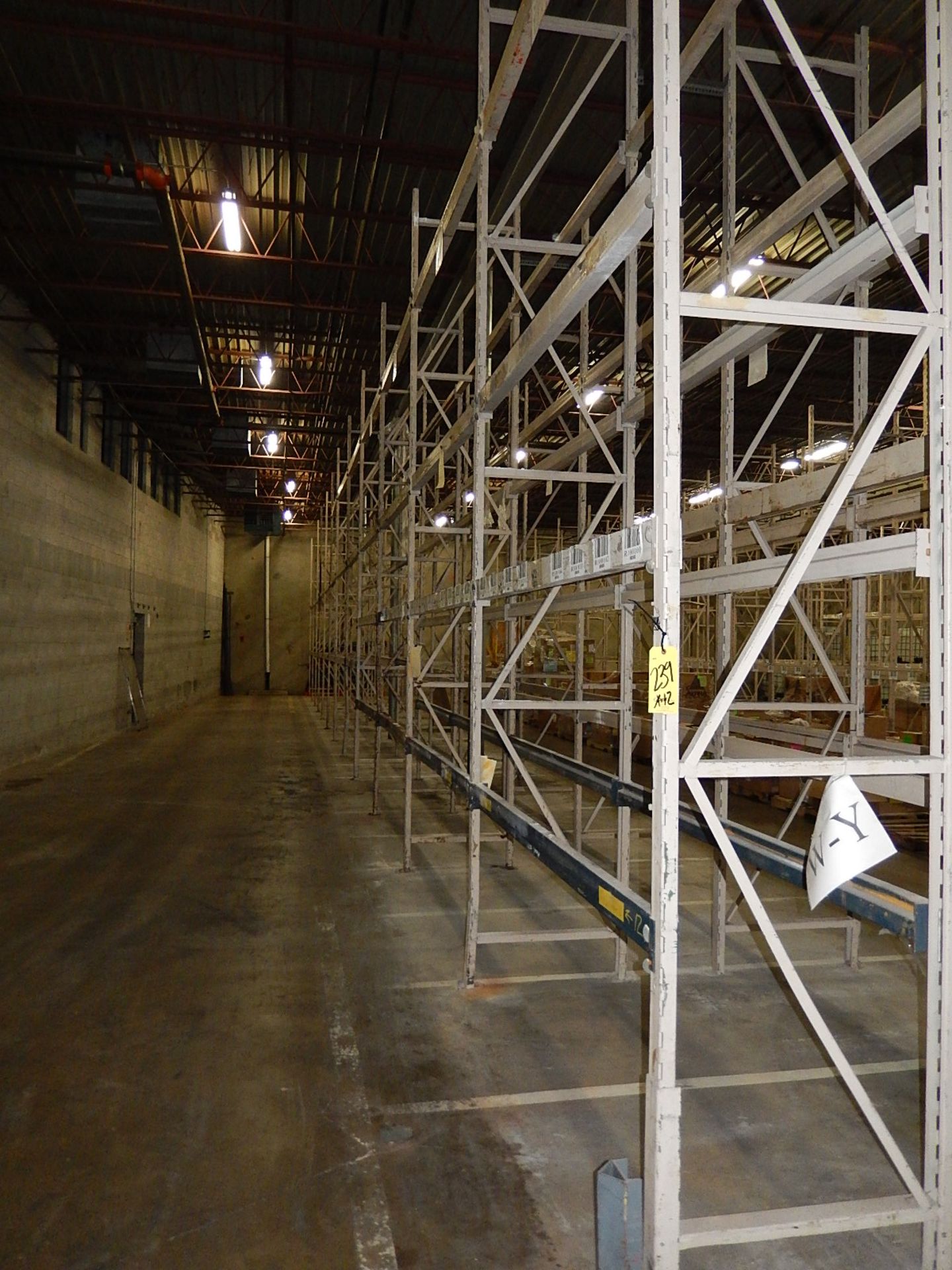 LOT: Pallet Rack: (12) Sections 32 in. Deep x 90 in. Wide x 16 ft. High (est.)