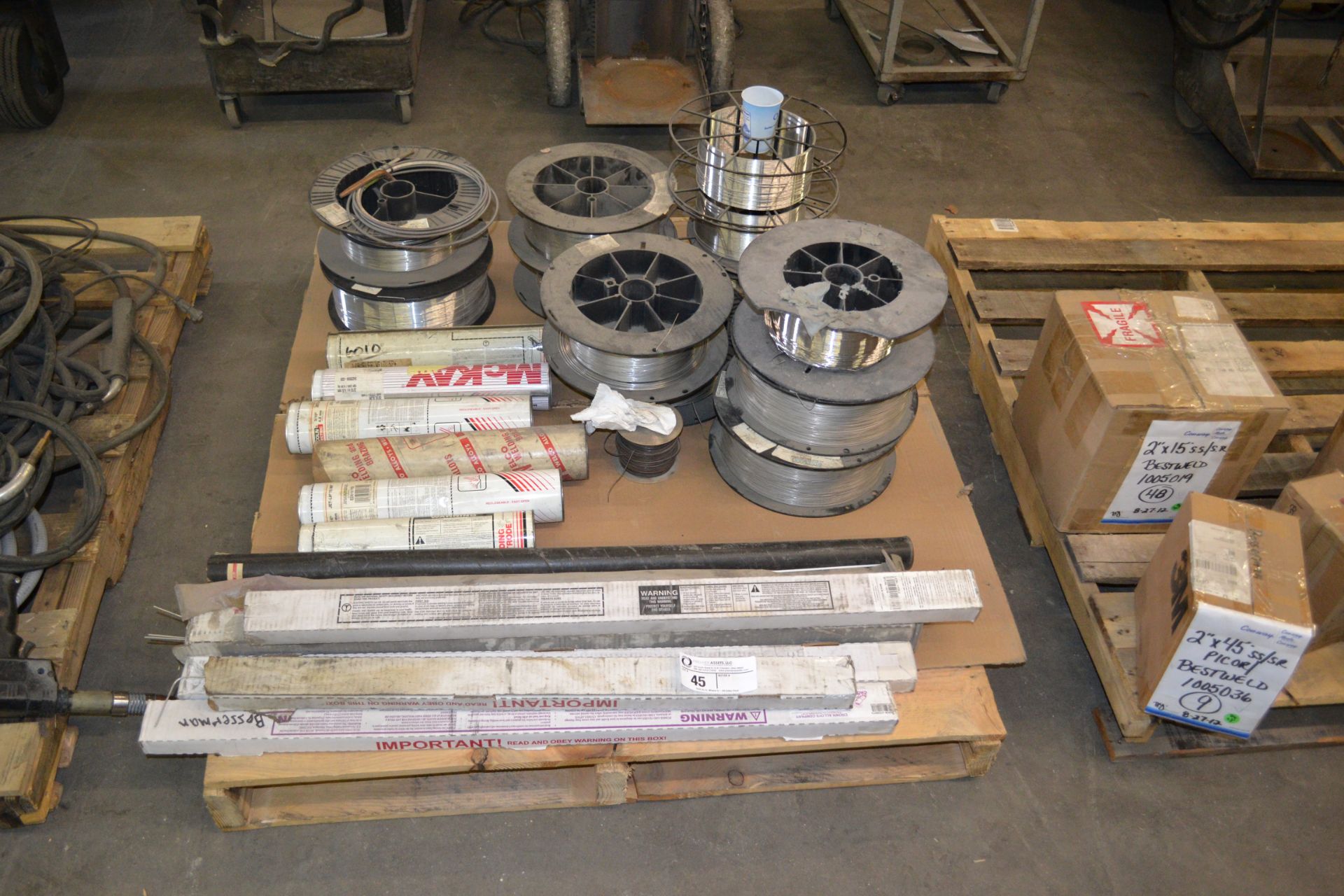 skids of spools of wire, welding rods and tig rods