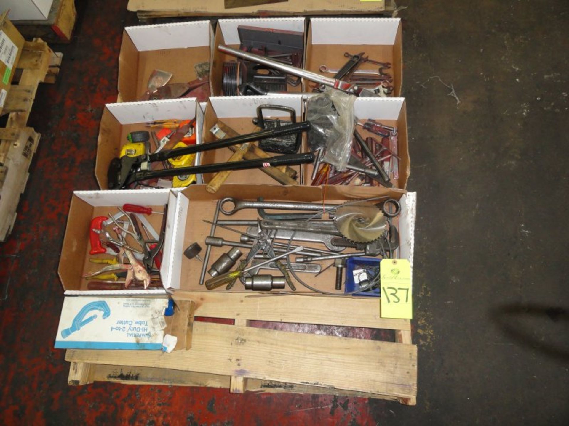 Assorted wrenches, tape measures, tools