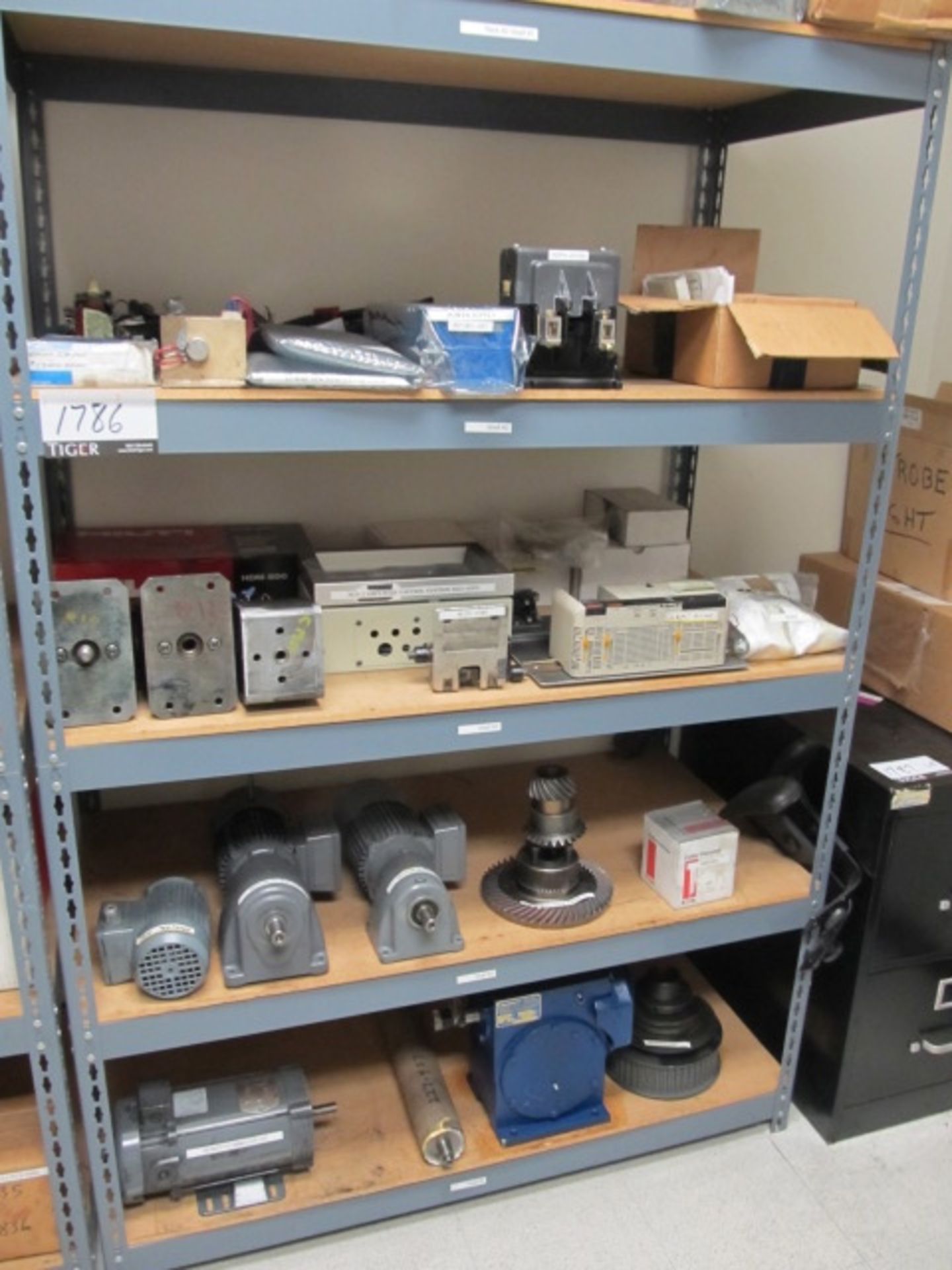 Lot Contents Of Rack, Including Assorted Gear Wheels, Motors, (4) Boxes Of Print Heads, Counters,