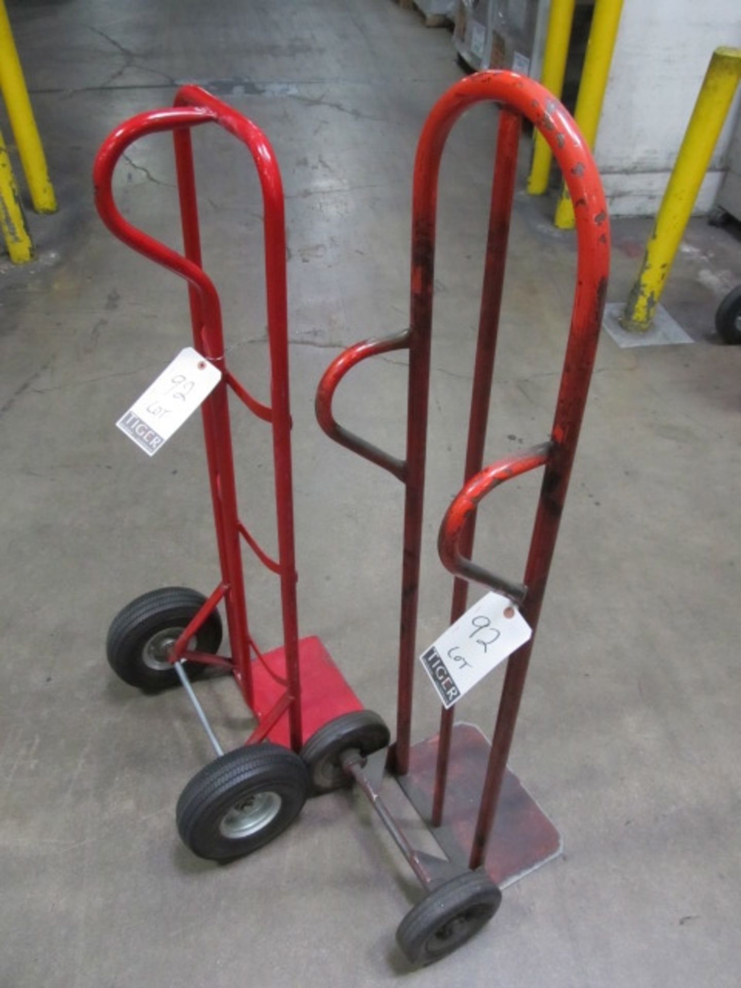 Lot (2) Assorted Hand Trucks With Solid And Pneumatic Wheels. Asset Location: West Warehouse, Site