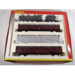 Model railways - a Hornby OO gauge train pack comprising 4-6-0 locomotive and tender,